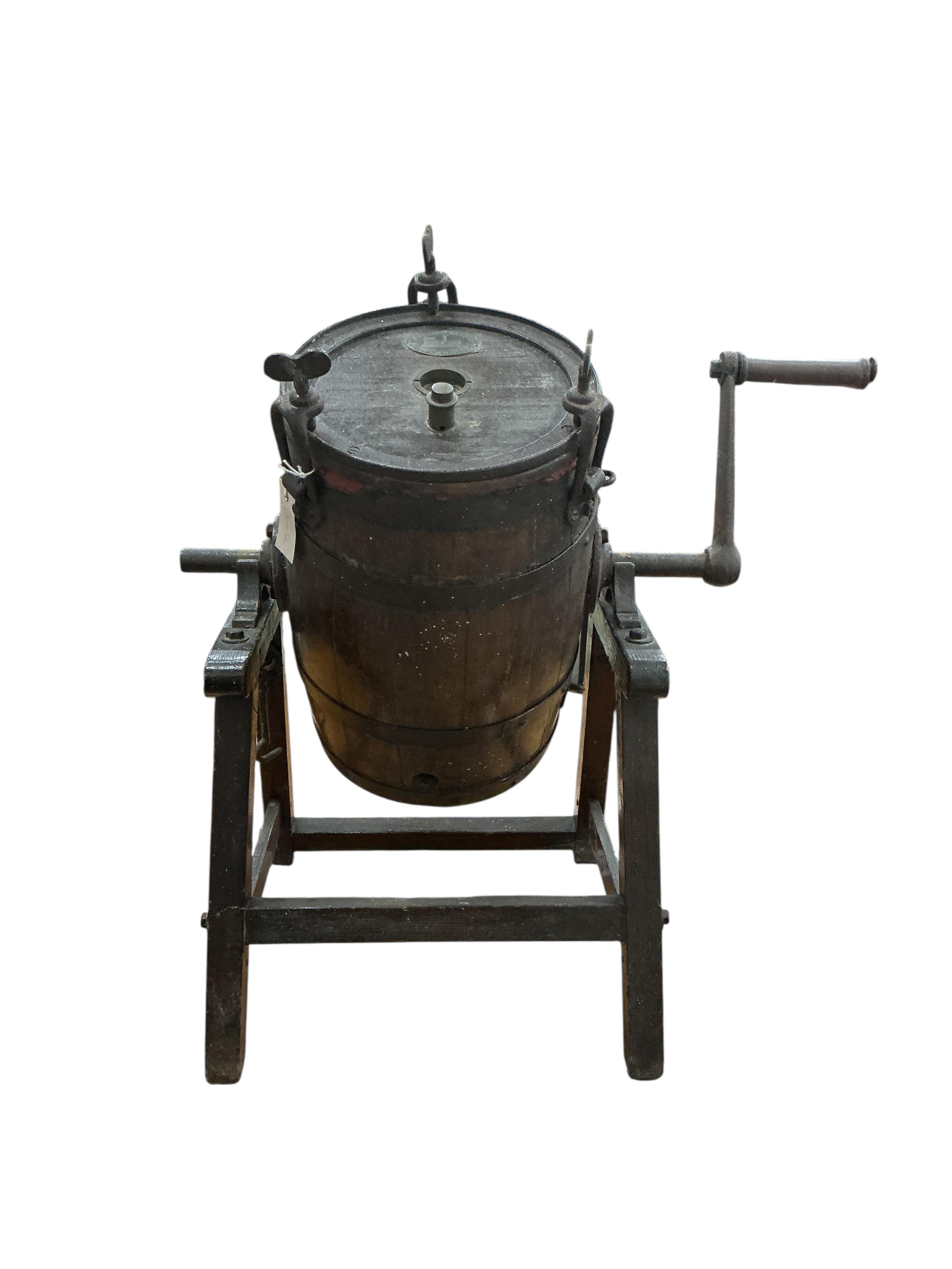 A Victorian Waide & Sons iron bound staved oak butter churn on stand